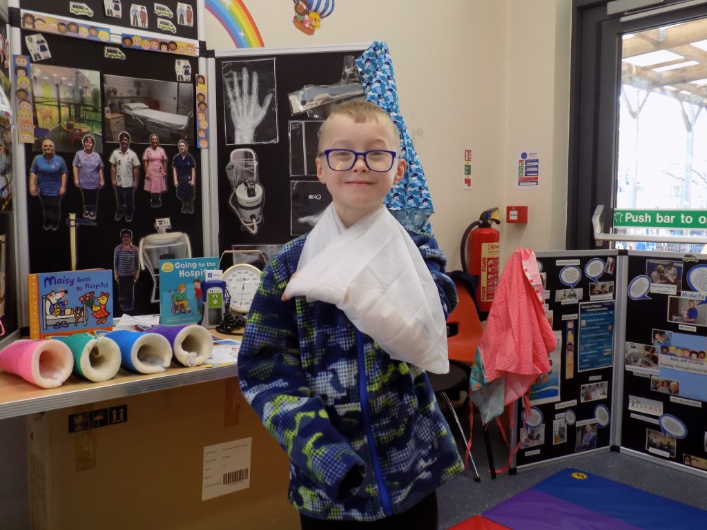 A picture of a boy called Daniel who has  his arm in a sling.