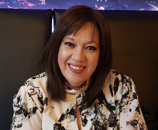 A picture of Tricia Hughes smiling