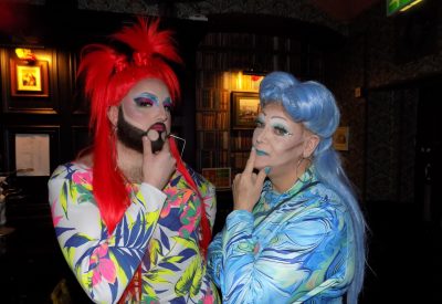 Photo of Miss Stephanie Sky and Miss Fonda both in their drag outfits and make up.