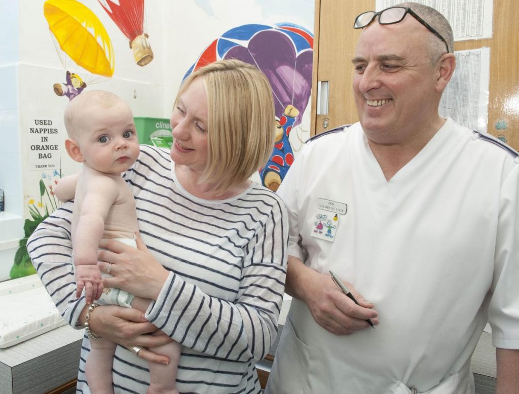 Nurse with mother and baby