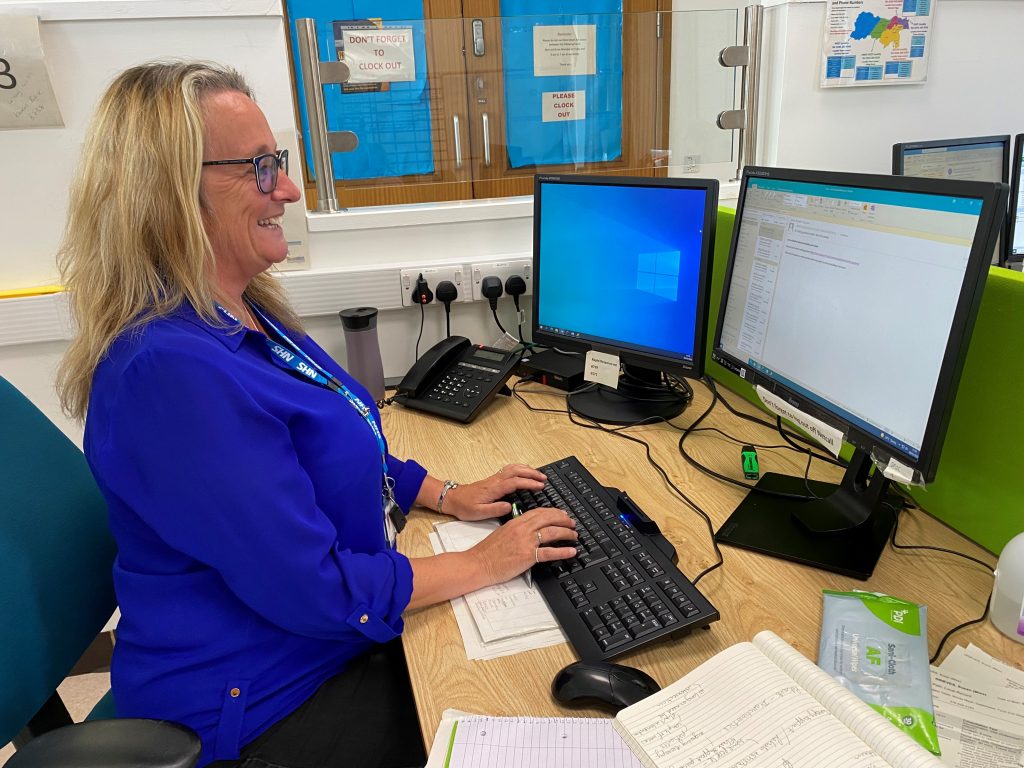 Karen Baskerville typing. She is the administrative lead for the Rapid Response Team. 