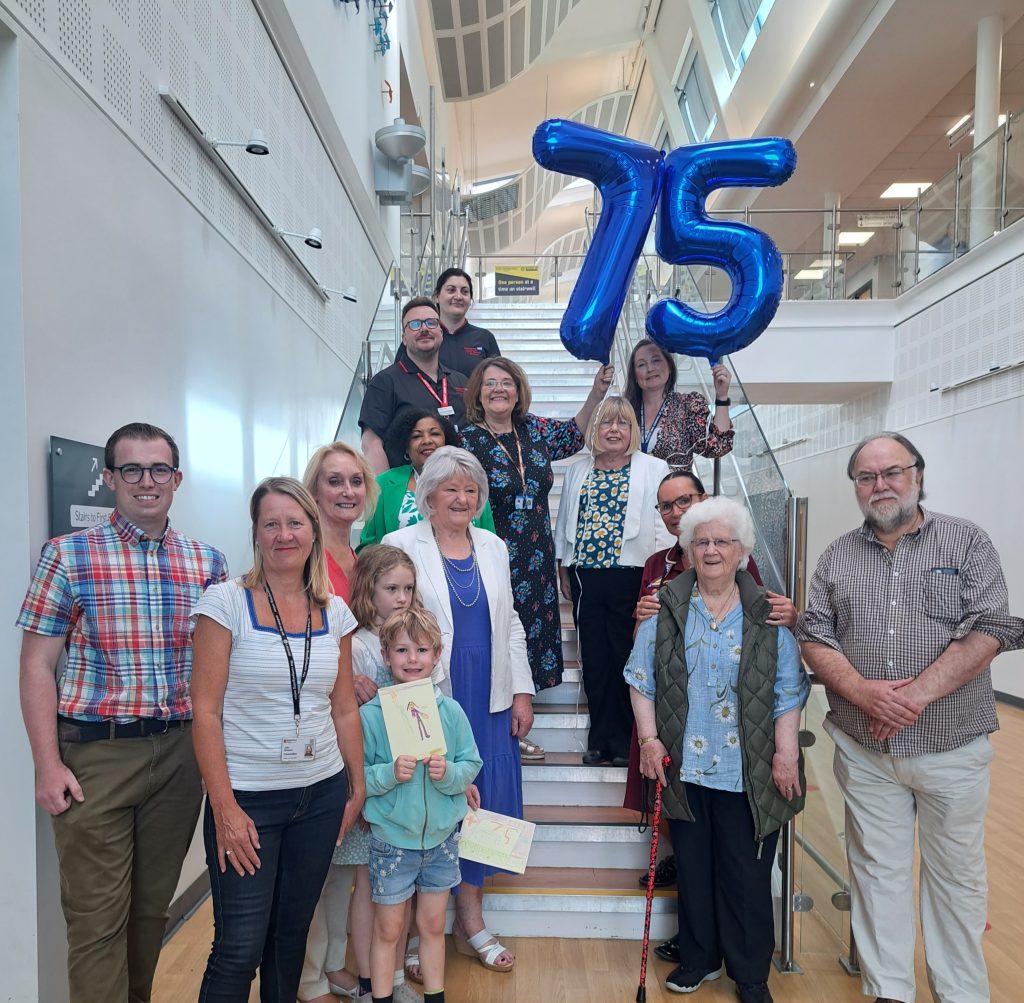 Staff with local MP, councillors and residents celebrating NHS75