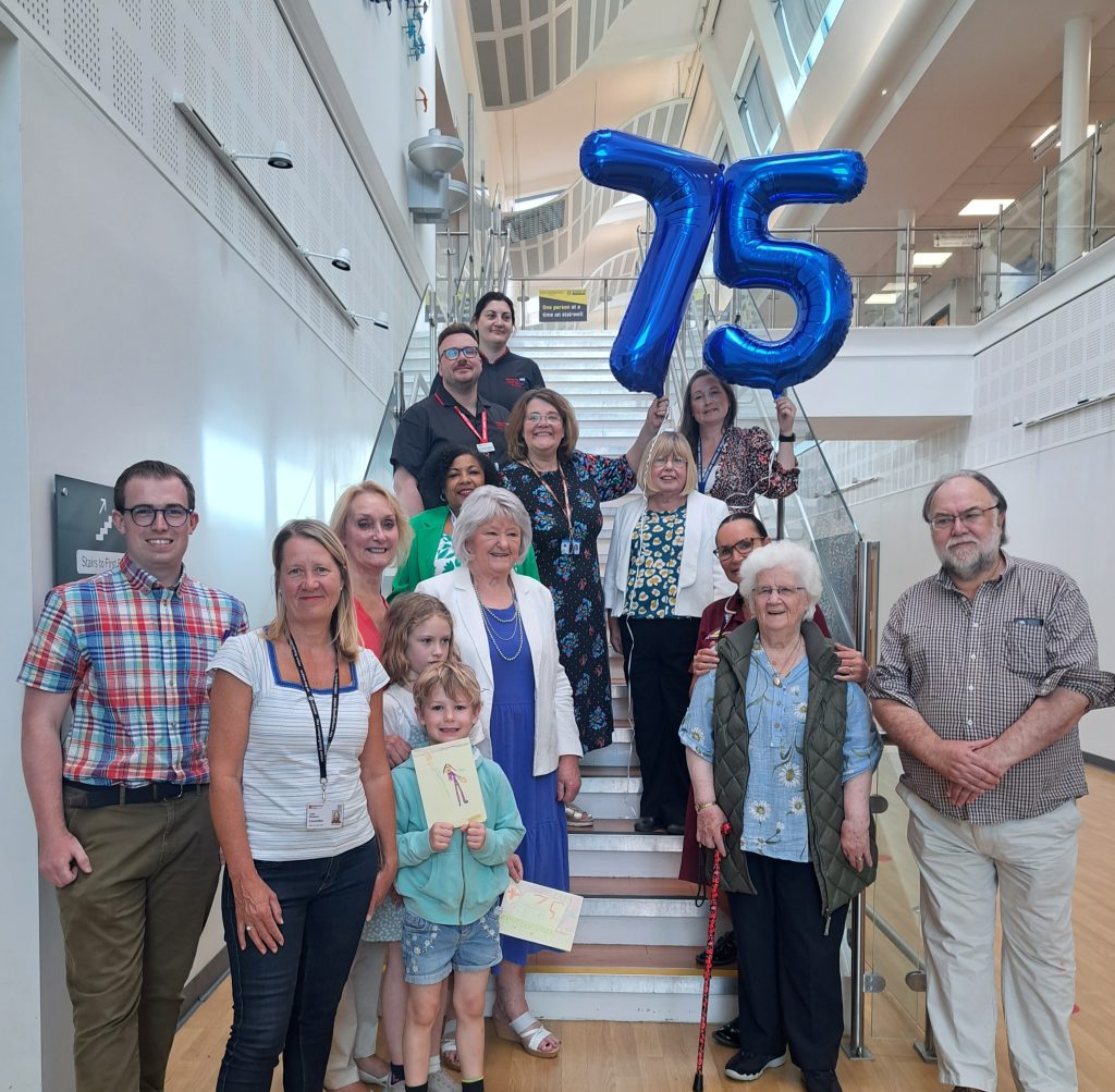 Staff with local MP, councillors and residents celebrating NHS75