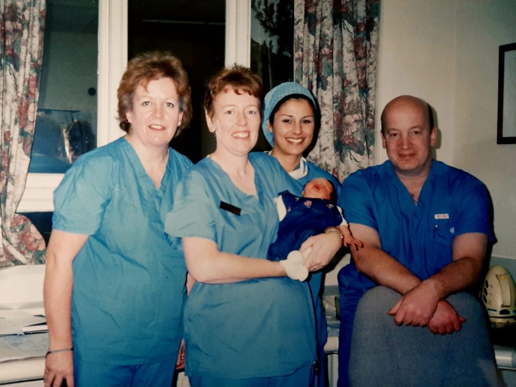 IVF team, including Ian Aird and a small baby.