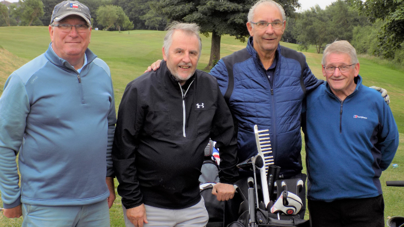 4 men with golf kit