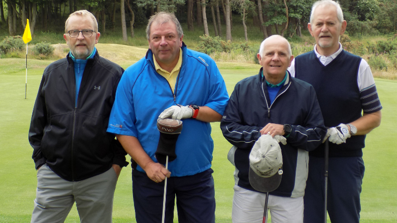 4 men in golf kit