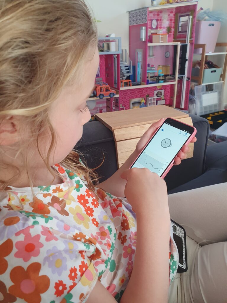 Child using mobile to manage diabetes