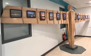 Wide angled photo of a wooden angel with photo frames attached