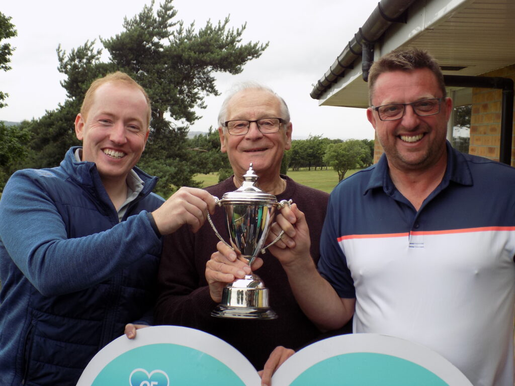 a photo of three men holding the Radio Tyneside Grand Slam Golf 2023 trophy