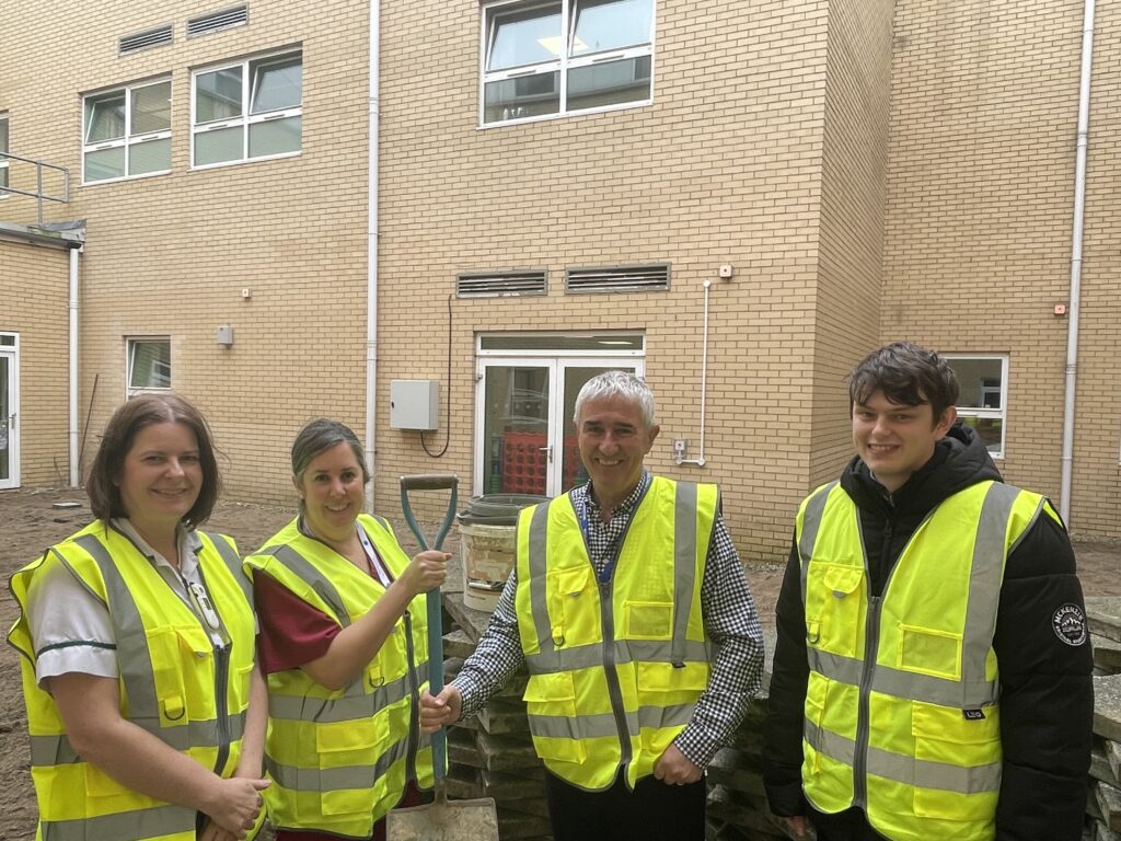 planning group members posing with equipment