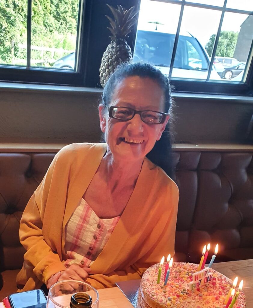 Ashleigh's mam on her birthday with a cake
