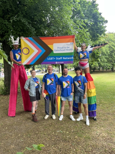 Group marching at pride