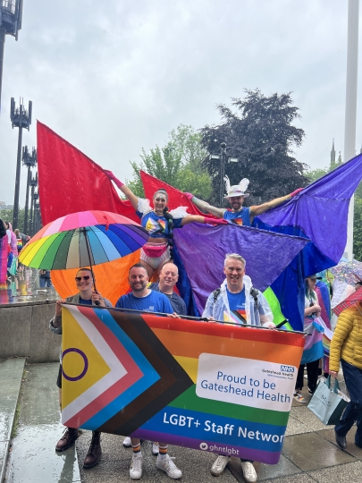 Group marching at pride