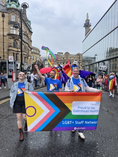 Group marching at pride