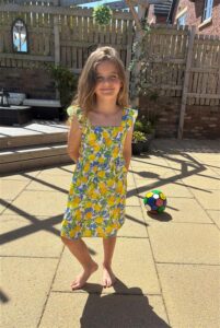 Full length photo of Molly, one of our young Charity runners.