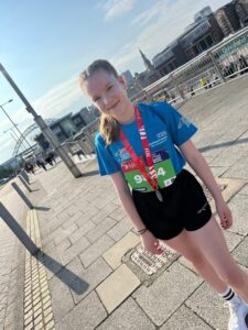 Full length photo of Renee, one of our young Charity runners