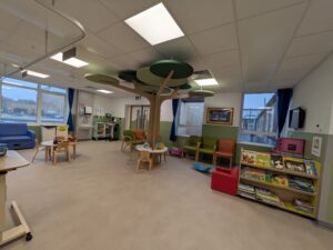 Wide angle photo of the day unit with the feature tree.