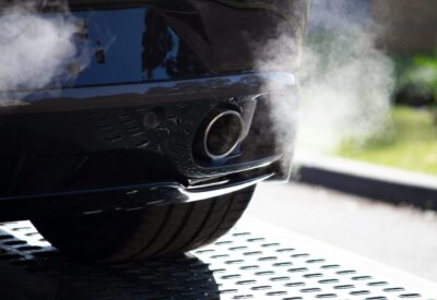 A car with engine exhaust fumes