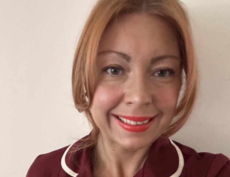A head and shoulders photo of Gemma, wearing her nursing uniform.