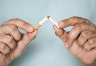 snapping a cigarette in half